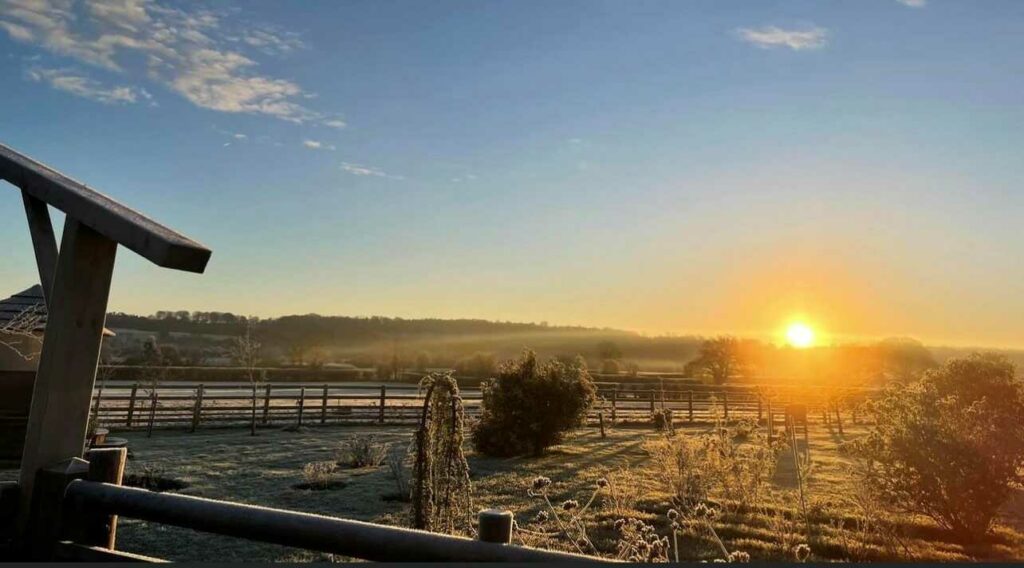 Sunrise on farm landscape on a frosty morning
